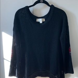 Cute black sweater with plaid elbow patches